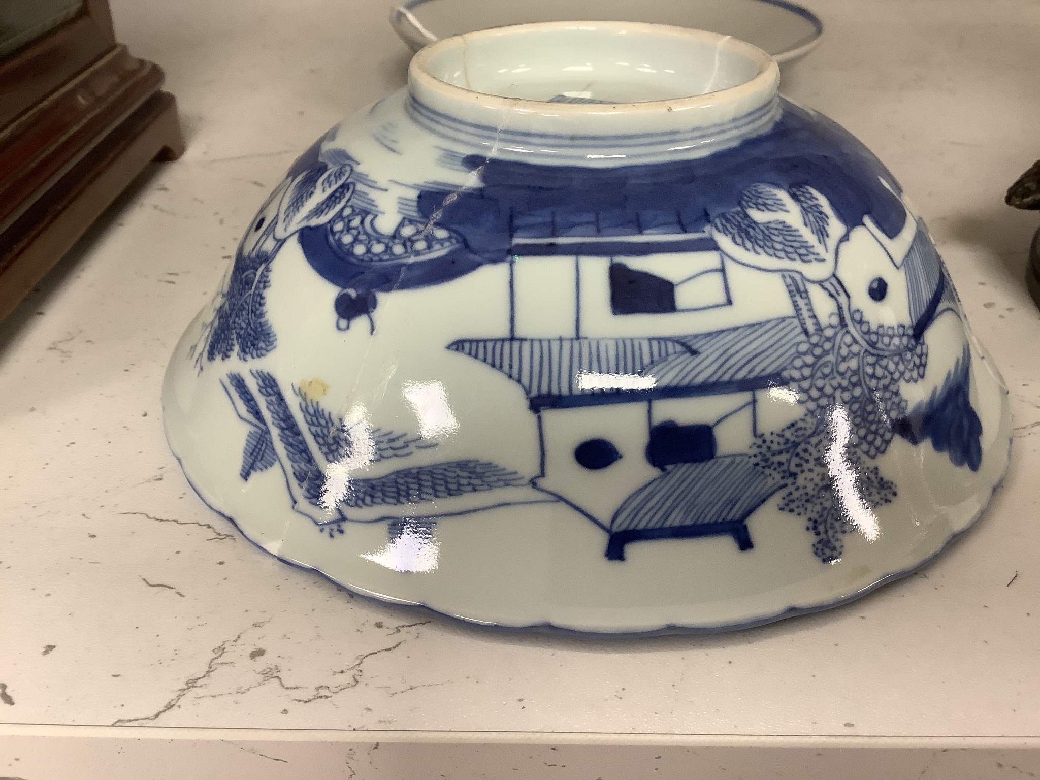 A Chinese blue and white landscape bowl, a/f and a Chinese blue and white ‘dragon’ dish, 18 and 16.5 cm